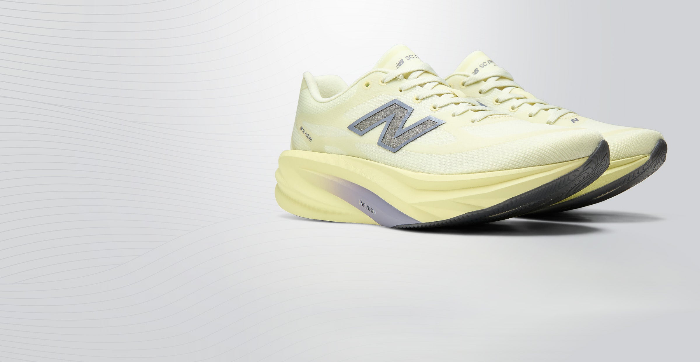 A variety of colorful running shoes are displayed against a beige background. A hand lifts a white shoe with blue and red soles, highlighting its design.