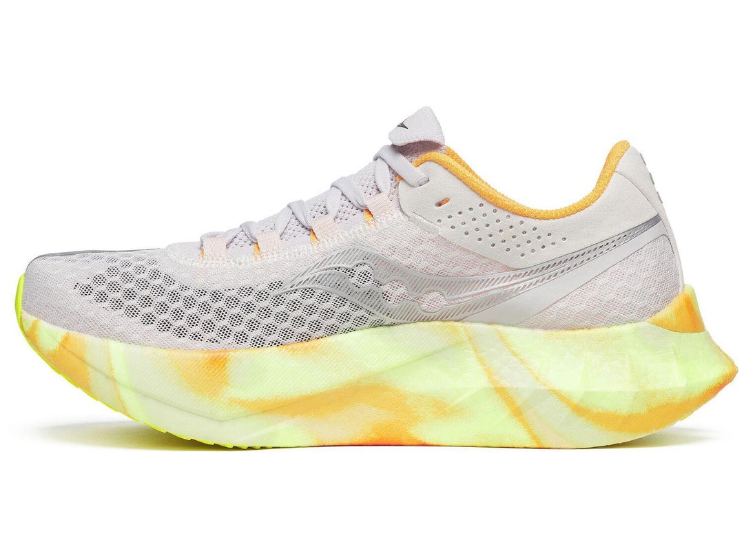 Left shoe of the Saucony Endorphin Pro 4. Upper is white. Midsole is yellow and orange.