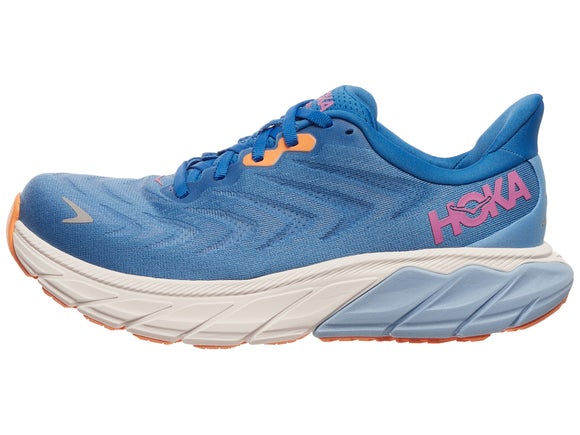 HOKA Arahi 6 running shoe. Upper is blue with a pink HOKA logo. Midsole is blue and white. 