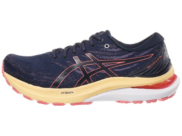 ASICS Gel Kayano 29 running shoe. Upper is navy and an orange outlined ASICS logo. The midsole is yellow and white. 