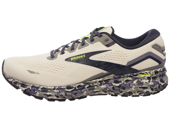 Brooks Ghost 15 running shoe. Ivory upper with black and neon green Brooks logo. Midsole is grey, purple and black print 