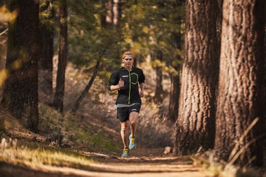 Tim running through the forest
