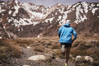 Tim running toward the mountains
