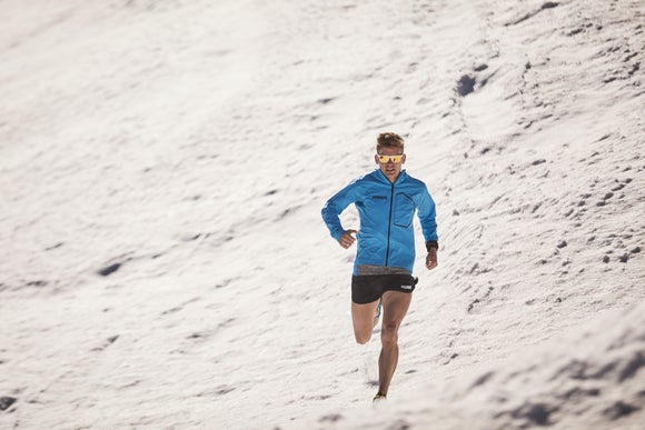 Tim running through the snow