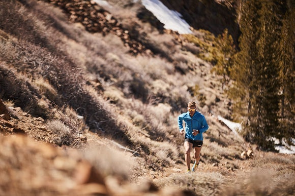 Tim running through the mountains