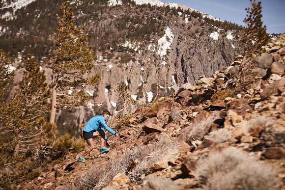 Tim running up a rocky hill